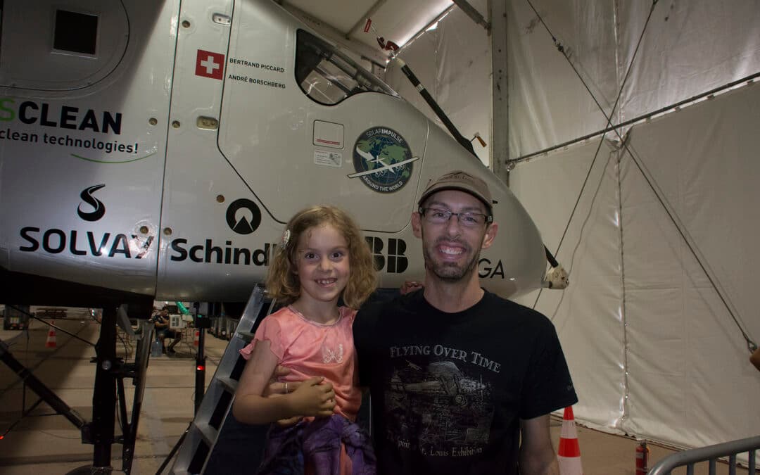 Nova Hall and Ara Hall beside the Solar Impulse aircraft at an aviation exhibition