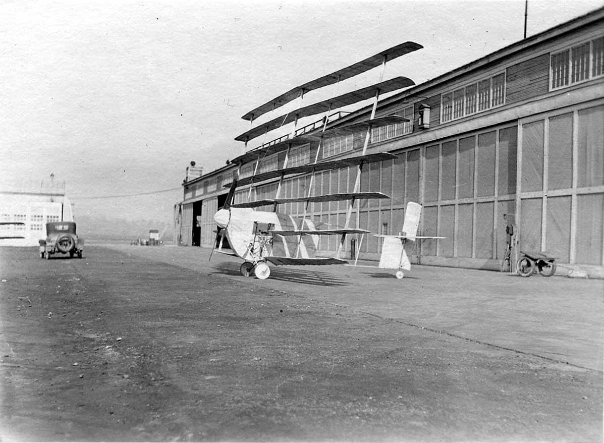 The experimental seven-winged Gerhardt Cycleplane parked on the concrete ramp outside the flight-test hangars at McCook Field.