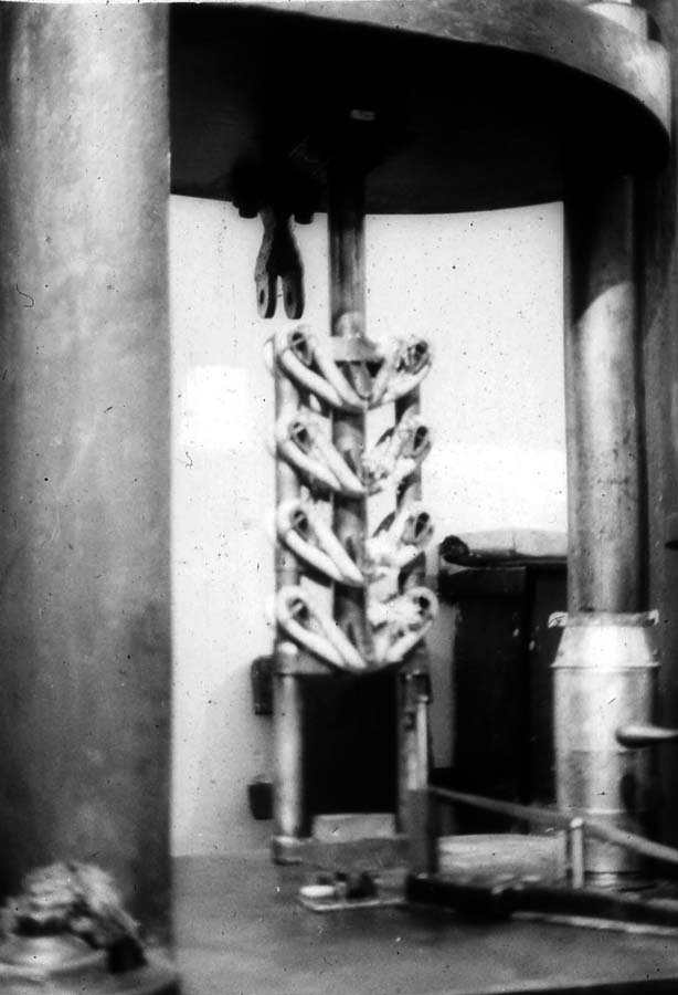 Testing machine running static load and deflection tests on rubber shock-absorber bungee rings for the Ryan NYP landing gear.