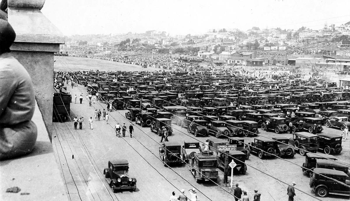 From the roof of Ryan Airlines with a mass of cars parking along Market St in San Diego. The engineers and employees on the roof enjoying the show.