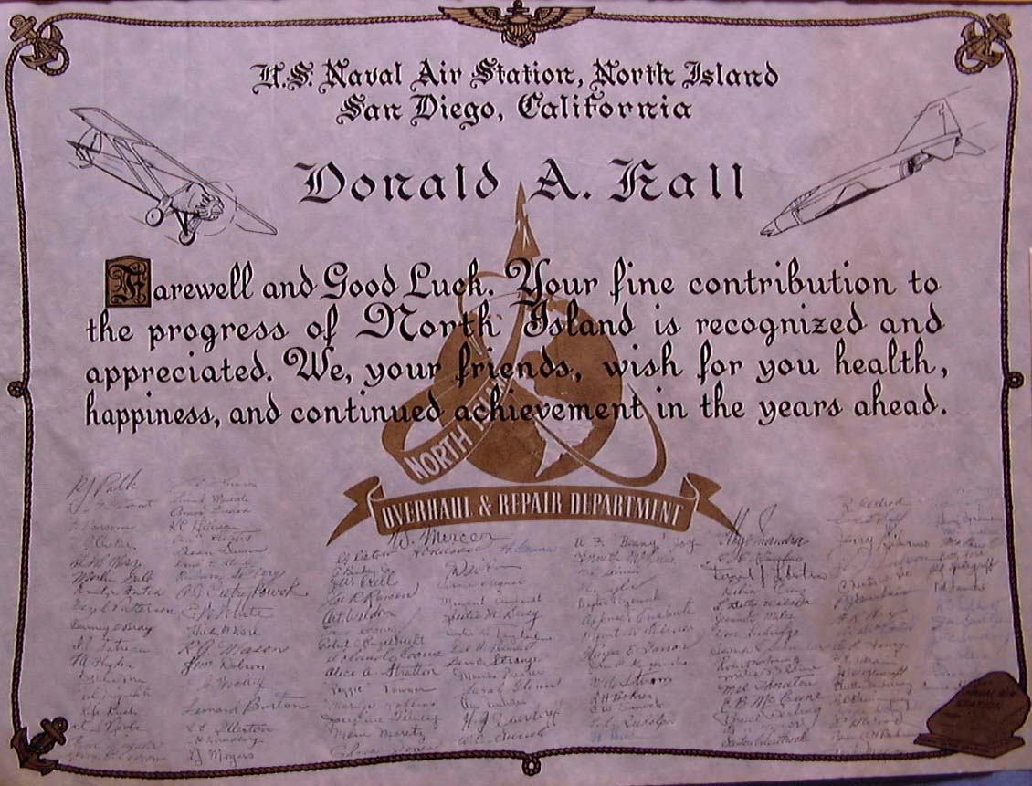 An illuminated calligraphic testimonial scroll from NAS North Island Overhaul and Repair Department hand-signed by fifty colleagues.