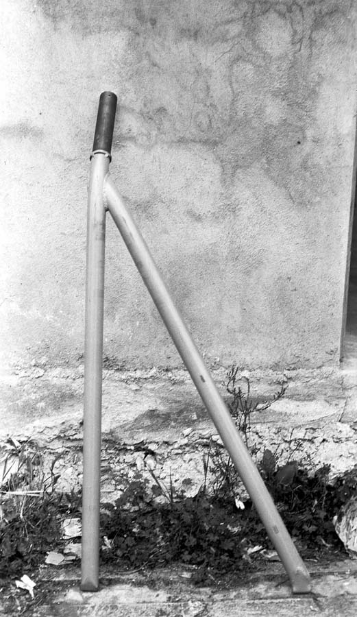 A standalone view of a heavy-duty, V-shaped steel axle and swing arm assembly designed for the Spirit of St. Louis landing gear.