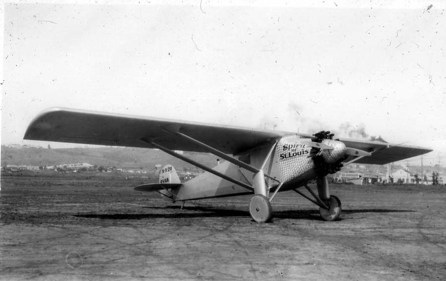 Three-quarter front view of the finished Spirit of St. Louis at Dutch Flats showing damascened nose cowl and wing lettering.