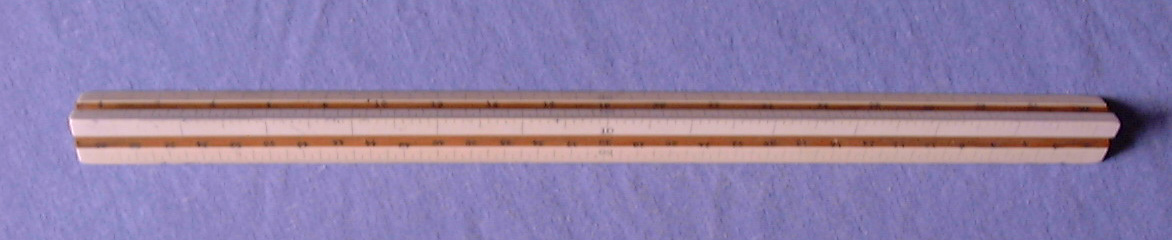 A professional architectural and engineering triangular boxwood drafting scale ruler used for aircraft structural design.
