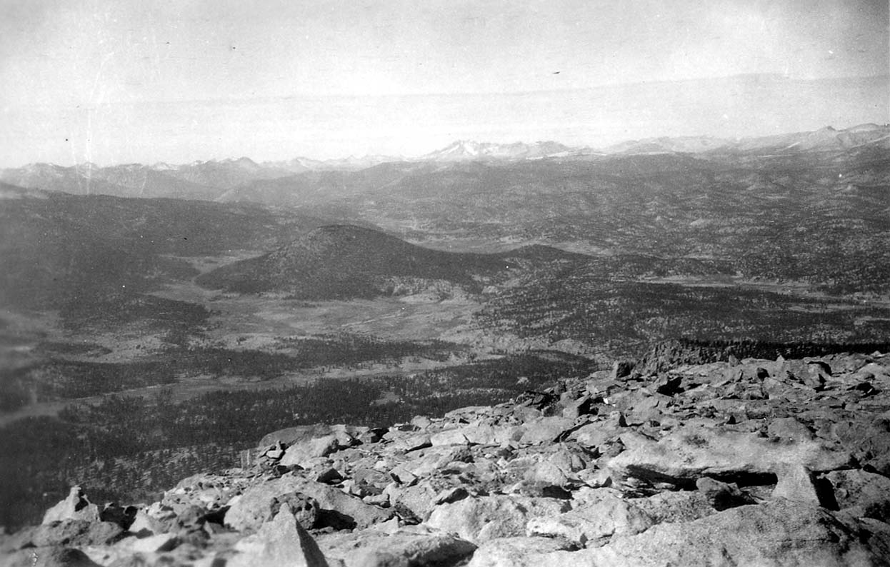 A wide panoramic-style view of overlapping mountain ranges.