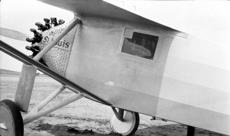 Flightline close-up of the Spirit of St. Louis forward fuselage showing damascened cowl, window, and periscope.
