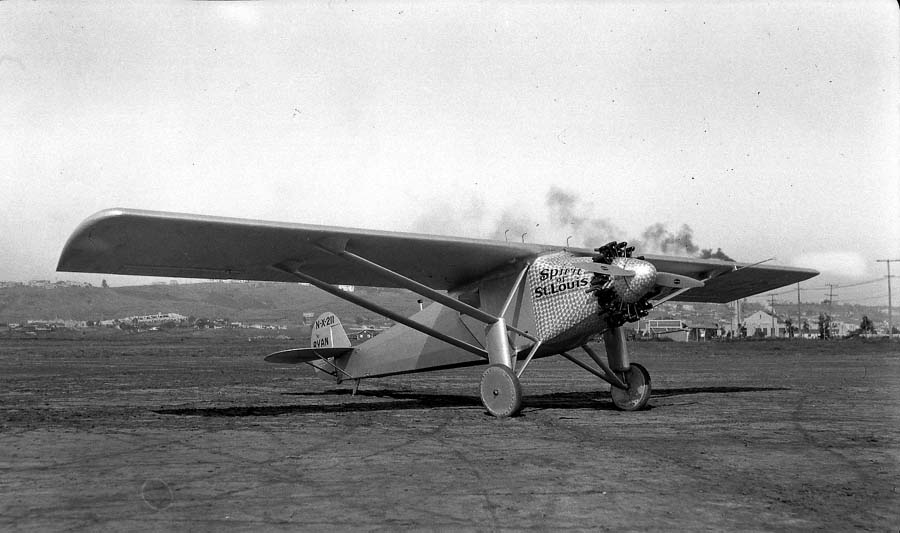 Three-quarter view of the Spirit of St. Louis starboard side showing damascened cowl and right cockpit door.