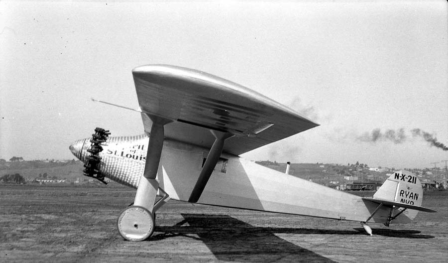 Full left three-quarter view of the Spirit of St. Louis on Dutch Flats with San Diego hills in the background.