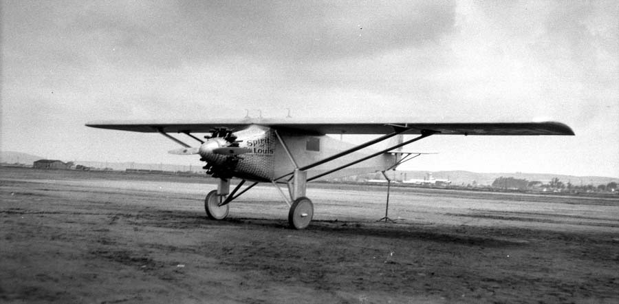 Three-quarter front view of the Spirit of St. Louis on Dutch Flats showing damascened cowl and tail support.